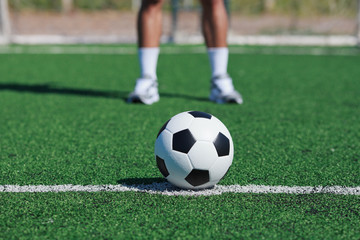 White stripe on the green soccer field from top view