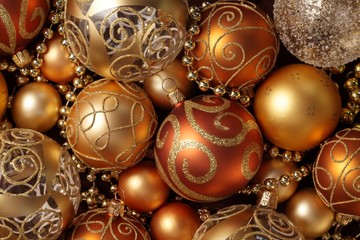 Golden Christmas ornaments background.