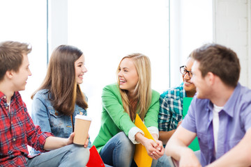 students communicating and laughing at school