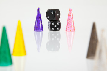 Different colored pawns isolated on a white background