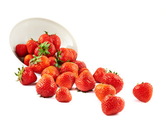 Scattered strawberries in a bowl