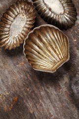 Top view of old cookie cutters on wooden background.