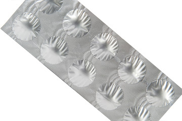 Closed up medicine tablet in aluminum foil strip show packaging