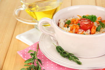 Delicious rice with vegetables and herbs in pot
