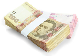 Obraz na płótnie Canvas Pile of Ukrainian money, isolated on white