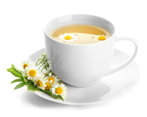 Cup of herbal tea with wild camomiles and mint, isolated