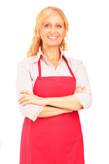 Smiling mature female worker wearing an apron