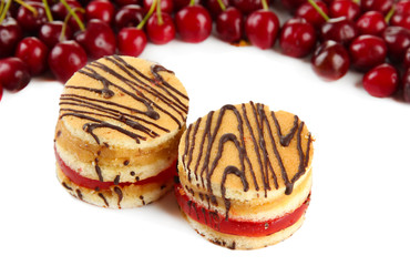 Tasty biscuit cakes and berries isolated on white