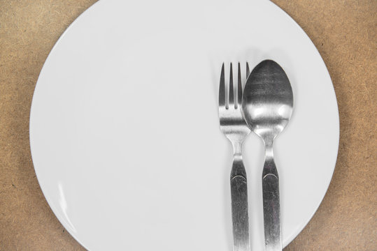 fork and spon on the white plate