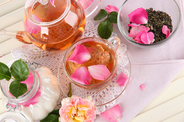 Kettle and cup of tea from tea rose