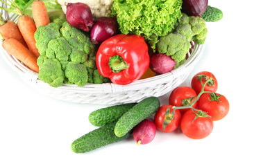 Fresh vegetables in white wicker basket close up