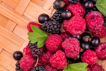 Fresh berries on a wicker backgound