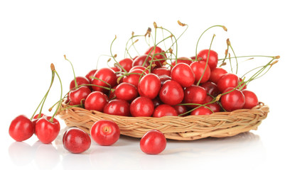 Cherry berries in wicker basket isolated on white