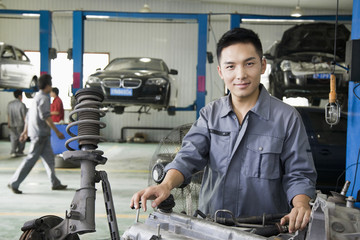 Mechanic Fixing Car Engine