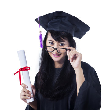 Asian female graduate smiling on white