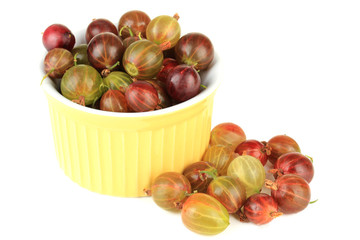 Fresh gooseberries in bowl isolated on white