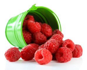 Ripe sweet raspberries in pail, isolated on white