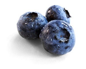 blueberries over white background