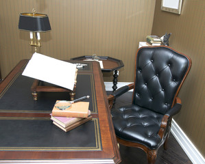 office with a comfortable chair and table made of wood