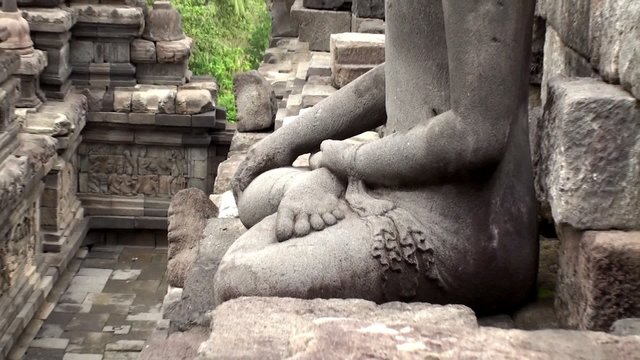 Statue of Buddha sitting in the lotus position.