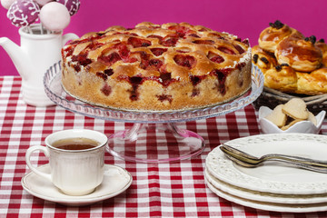 Strawberry pie on cake stand, fuchsia background