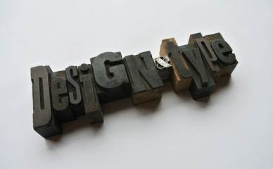 Design and Type words composed with wooden typography