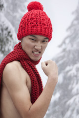 Shirtless Man with Hat and Scarf in the Snow