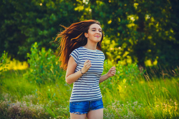 Naklejka na ściany i meble brunette striped t-shirt runner woman young running outdoors, pr