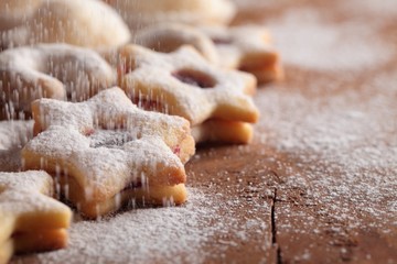 Fototapeta na wymiar Christmas cookies and pouring sugar