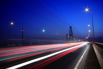 Fototapeta na wymiar dusk urban night traffic on the highway
