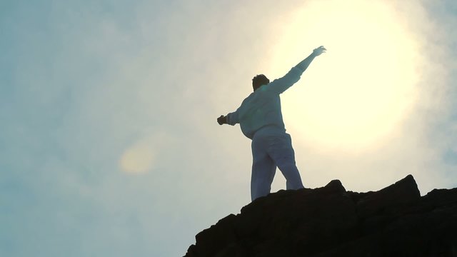 Man's Sylohuette Stretching Arms Heaven Colorful Religious