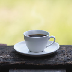 Cup of espresso on a wooden table