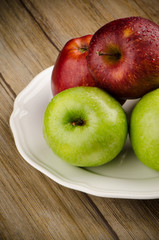 Apples in a ceramic white plate