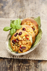Breakfast buns with vegetables in wicker basket