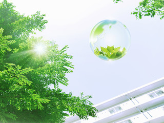地球エコイメージ　高層住宅と新緑を映す地球