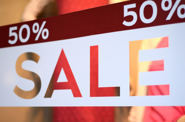 Sale Sign In A Clothing Store Window (With Shallow DoF) - obrazy, fototapety, plakaty