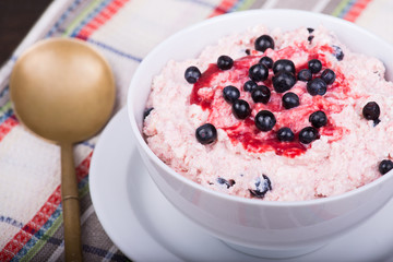 Cottage cheese with strawberry jam and blueberries