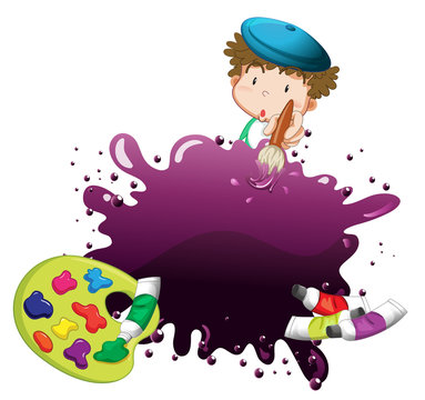 A young boy painting
