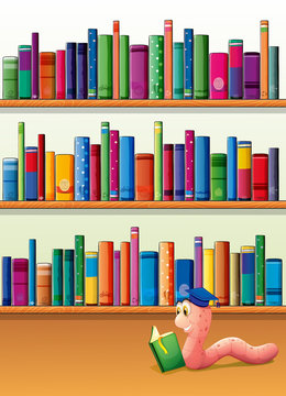 An earthworm reading a book in front of the shelves with books