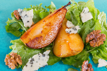 Fototapeta na wymiar Salad with caramelised pears,walnuts and blue cheese