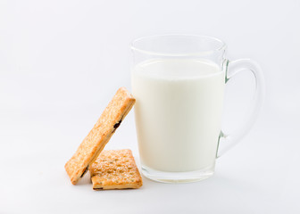 Glass of milk with cookies isolated on white background