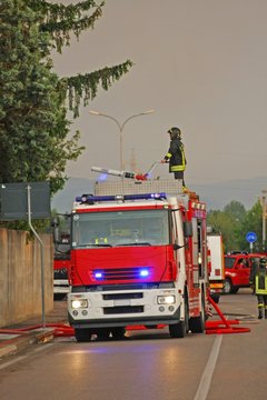 firefighters with the fire truck when switching off a fire