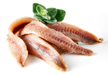 anchovies on white with oregano - obrazy, fototapety, plakaty