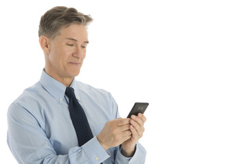 Handsome Businessman Text Messaging On Mobile Phone