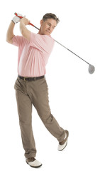 Man Swinging Golf Club Against White Background