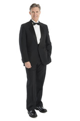 Portrait Of Mature Man Wearing Tuxedo Smiling