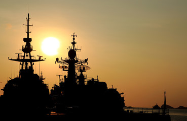 battleship with sunset behind