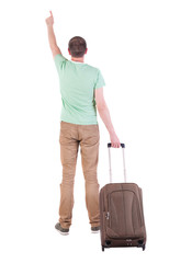 back view of  man  with suitcase.
