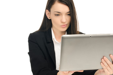 Beautiful business woman using a tablet at work