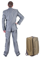 Back view of traveling busness man with  suitcase